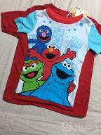img 1 attached to Sesame Street Elmo Pajamas for Toddlers - 2 Piece Pajama Set with Slippers, 100% Cotton - Available in Toddler Sizes 2T to 5T review by Daniel Woods