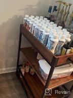 img 1 attached to Rustic Brown Bar Cart With Lockable Castors, Adjustable Feet, And Storage Shelves - Ideal For Parties, Entertaining, And Hosting - Includes Wine Glass Hooks And Easy Assembly review by Angelina Collins