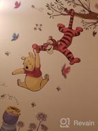 img 1 attached to Sweeten Your Walls With RoomMates Winnie The Pooh Swinging For Honey Wall Decals! review by Chase Hosea