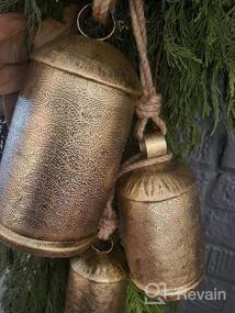 img 7 attached to Deco 79 Bronze Tibetan-Style Meditation Cow Bells With Jute Hanging Rope, Set Of 3 (12", 9", 6"H) For Indoor/Outdoor Decor