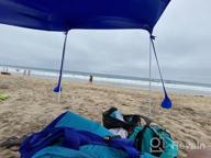 img 1 attached to AMMSUN Beach Tent With Sandbag Anchors, Portable Canopy Sun Shelter,7 X 7Ft -Lightweight, 100% Lycra SunShelter With UV Protection. Sunshade For Family At The Beach, Camping & Outdoor (Dark Blue) review by Thomas Silva
