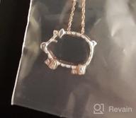 img 1 attached to 14K Gold Over Sterling Silver Two Tone Pig Pendant with Round Cut White Natural Diamond Accents review by Ameen Bethea