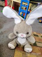 img 1 attached to Bundaloo Peek-A-Boo Bunny Animated Musical Plush Toy - Moving Floppy Ears & Glowing Heart - Plays Peek-A-Boo & Sing Do Your Ears Hang Low - Interactive Grey Singing Stuffed Bunny For Boys & Girls review by Richard Bowens