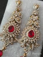 img 1 attached to Exquisite 'Touchstone Hollywood Glamour Oscar Collection' Indian Paisley Motif Designer Bridal Jewelry: Long Chandelier Earrings in Antique Gold and White Tone for Women review by Vijin Wisniewski