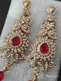 img 7 attached to Exquisite 'Touchstone Hollywood Glamour Oscar Collection' Indian Paisley Motif Designer Bridal Jewelry: Long Chandelier Earrings in Antique Gold and White Tone for Women