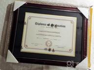 img 1 attached to Cherry Finish Diploma Frame For 8.5X11 Diplomas And 11X14 Certificates - Solid Wood, UV Protection, Black Over Gold Mat, Gold Trim review by Dawn Babyiee