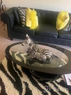 img 1 attached to Modern Black Oval Glass Coffee Table With Round Hollow Base - Perfect For Home Living Room Furniture! review by Gillian Francis