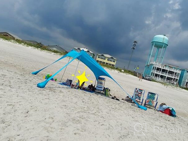 img 1 attached to Portable Beach Tent Sun Shelter 10X10Ft UPF50+ Protection With 4 Sand Bags & Aluminum Poles For Family Camping, Outdoor And Beach Use. review by Brian West