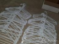 img 1 attached to Hangorize 60 Standard Everyday White Plastic Hangers, Long Lasting Tubular Clothes Hangers, Value Pack Of 60 Clothing Hangers. (60 Pack) review by Eric Fish