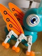 картинка 1 прикреплена к отзыву Музыкальная светящаяся игрушка Moontoy Penguin Baby для обучения и игр - идеальный подарок для младенцев и малышей в возрасте от 6 до 24 месяцев от Deanna Cook