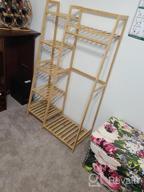 img 1 attached to Bamboo Clothing Rack With 5-Tier Storage Shelf For Coats, Jackets, Pants, Shoes, Plants - Perfect For Home, Laundry And Commercial Use (Ladder Design) By COOGOU review by Amy Weaver