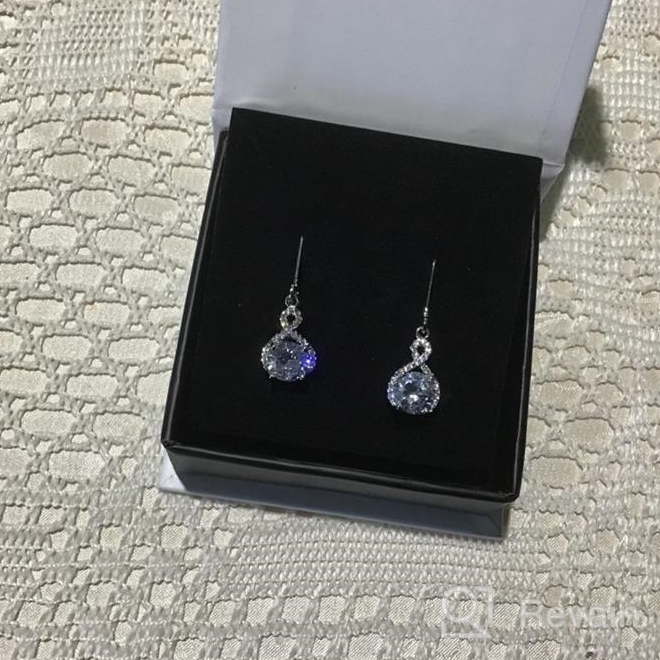 img 1 attached to Jade Marie FAITHFUL Silver Infinity Halo Drop Earrings: Stunning 18k White Gold Plated Dangle Earrings with Cubic Zirconia Crystals review by Amanda Lemons