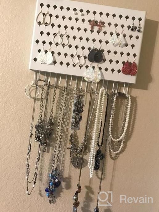 img 1 attached to Black Wall Mounted Jewelry Organizer With 117 Holes And 12 Hooks For Earrings, Necklaces, And Bracelets - Display Hanger By JackCubeDesign (16.54 X 12.2 X 0.75 Inches) review by Andrea Sloan