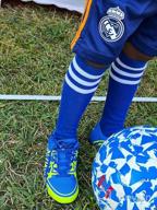 картинка 1 прикреплена к отзыву 🧦 Яркие коленные футбольные носки для мальчиков и девочек - идеальные трубчатые носки с полосками для малышей и младенцев от Brian Pius