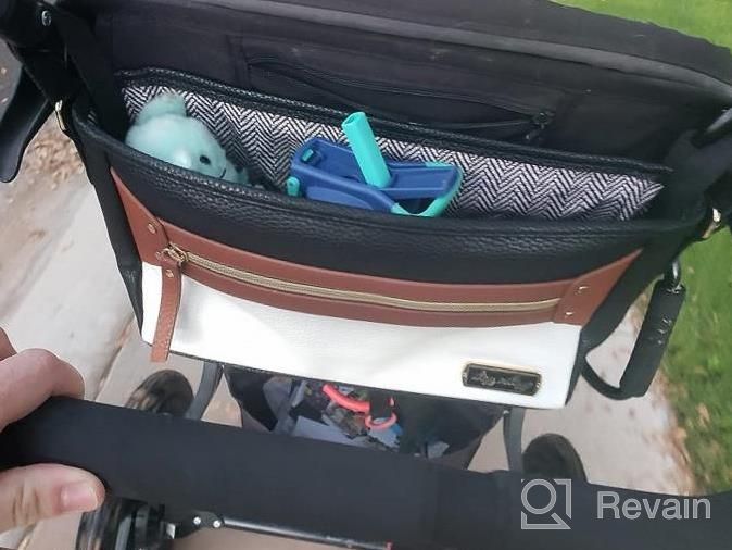 img 1 attached to Organize Your Stroller With Itzy Ritzy Adjustable Caddy - 2 Built-In Pockets, Front Zipper & Fits Most Strollers! review by Heidi Young