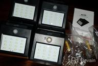 img 1 attached to Secure Your Outdoor Spaces With Housmile Solar Motion Sensor Light - 16 LED, Rainproof, 2 Intelligent Modes - 4PACK review by Billy Danaher