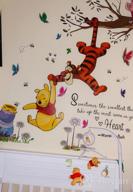 img 1 attached to Sweeten Your Walls With RoomMates Winnie The Pooh Swinging For Honey Wall Decals! review by Rudolph Mceachern