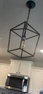 img 1 attached to Industrial Vintage Iron Cage Lantern Pendant Light With Matte Black Finish, E26 Base - Perfect Hanging Chandelier For Dining Room And Kitchen (Bulb Not Included) review by Daniel Pesicek