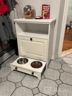img 1 attached to Stylish White Farmhouse Pet Station With Pull Out Bowls & Storage Cabinet For Modern Pet Care review by Jonah Riggle