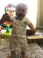 картинка 1 прикреплена к отзыву Adorable Baby Boy White Gentleman Tuxedo Romper With Waistcoat, Bowtie, And Jumpsuit Overall от Dan Buycks