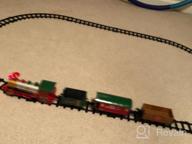 img 1 attached to Experience The Magic Of The Holidays With PUSITI Classic Christmas Train Set - Battery Operated Locomotive Engine And 11.5 Ft Tracks With Lights And Sounds For Kids' Delight review by John Graves