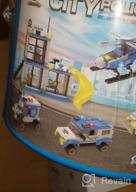 картинка 1 прикреплена к отзыву Конструктор городского полицейского участка с машинами полиции, полицейским вертолетом, фургоном тюрьмы, увлекательной игрушкой полиции для детей, лучший подарок в конструкционных науках для мальчиков от 6 до 12 лет (808 деталей) от Bill Sorenson