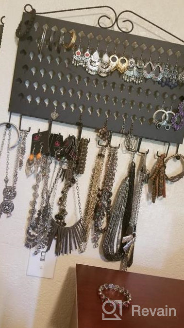 img 1 attached to Black Wall Mounted Jewelry Organizer With 117 Holes And 12 Hooks For Earrings, Necklaces, And Bracelets - Display Hanger By JackCubeDesign (16.54 X 12.2 X 0.75 Inches) review by Walter Harmon
