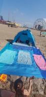 img 1 attached to WELLAX Waterproof Beach Blanket - 9X10 Ft, Sand Repellent, Lightweight And Durable For 8 Persons With 8 Pockets And 4 Stakes - Perfect For Picnics, Camping, Travel & Outdoor Activities. review by Jon Estell