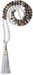 ethnic charm: coai hand knotted tassel stone mala necklace with 108 beads logo