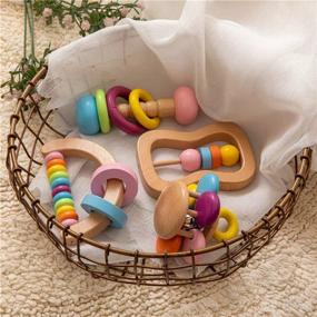 img 3 attached to Organic Colorful Baby Rattle Set - Safe Food Grade Wood Rattlers, Soother Bracelets, and Teethers for Montessori Toddler Toy - Multicolored (4pc)