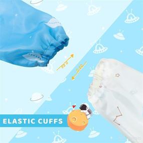 img 3 attached to 🍽️ Little Dimsum Mess-Proof Baby Bibs: Long Sleeve Waterproof Feeding Smock for Infants and Toddlers - Catch Food & Wipe Clean! (Pack of 2 Colors: Glatic & Spaceship)