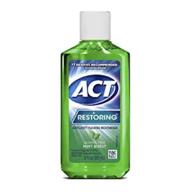 act restoring anticavity fluoride mouthwash oral care and mouthwash logo
