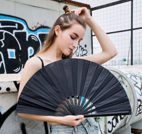 img 2 attached to Amajiji Black Large Hand Fan For Men And Women - Ideal For Rave, Chinese And Japanese Kung Fu Tai Chi Performances, Festivals, Crafts, And Gifts - Folding Dance Fan With Stunning Performance