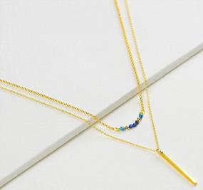 img 3 attached to 24K Gold Plated Layered Necklace Set For Women - Dainty Choker Y Pendant, Stackable Boho Bar Ring Disc Arrow Horn Adjustable Beaded Jewelry