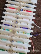 картинка 1 прикреплена к отзыву Набор ярких браслетов с 12 штуками, регулируемый на 12 штук - Отгоняйте мало червейства с браслетами с счастливыми бусинами "Злой глаз" для женщин, девочек и мальчиков. от Christina Luhrs