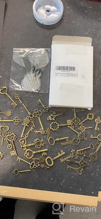 img 1 attached to 40 Flying Keys Charms With Dragonfly Wings, Vintage Skeleton Key DIY Set, And Elastic Crystal String For Perfect Wedding And Party Decorations review by Jason Rosekrans