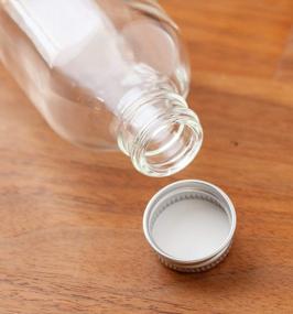 img 1 attached to Set Of 12 Clear Glass Boston Round Bottles With Silver Metal Screw-On Caps And Included Funnel