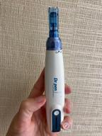 img 1 attached to Electric Microneedling Pen Professional Kit With 20 Replacement Cartridges And Storage Bag For Face And Body Home Use- Boost Collagen Production And Improve Skin Texture With Derma Pen. review by Sean Young