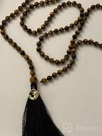 img 1 attached to 108 Mala Beads Necklace Hand Knotted Tassel Charm OM COAI review by Sandra Reyes