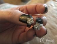 img 1 attached to Stylish And Hypoallergenic Sterling Silver Cubic Zirconia Earrings With Adorable Dog And Cat Paw Designs review by Don Santos