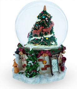 img 3 attached to Musical Snow Globe With Santa, Snowman & Dogs Watching Christmas Tree - Perfect For Holiday Decor!