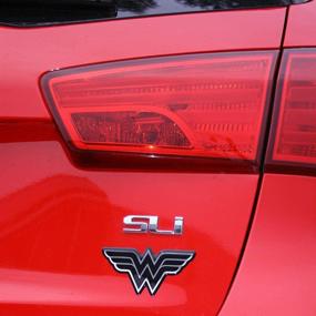 img 1 attached to 🦸 Eye-Catching Fan Emblems Wonder Woman Domed Chrome Car Decal - Classic Logo in Black and Chrome