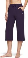 get fit in style with tsla women's capri bootcut yoga pants - high waist, flared, and packed with pockets! logo