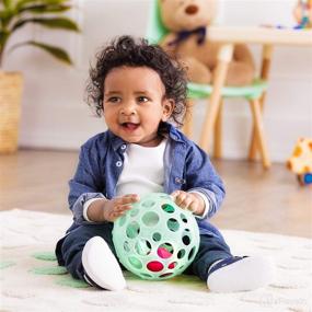 img 3 attached to B. toys by Battat Baby Ball – Sensory Light-Up Toy – Grab n’ Glow™ – Textured Ball with Holes – Glowing Lights & Rattle – Infant, Baby – Ages 0+