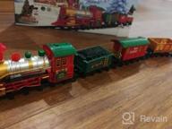 img 1 attached to Experience The Magic Of The Holidays With PUSITI Classic Christmas Train Set - Battery Operated Locomotive Engine And 11.5 Ft Tracks With Lights And Sounds For Kids' Delight review by Tim Thomason