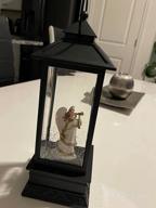 img 1 attached to LED Snow Globe Christmas Lantern: Musical, Spinning, And Glittery Decor With USB/Battery Option - Perfect Xmas Home Decor And Gift Idea review by Chris Laznovsky