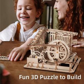 img 3 attached to Robotime 3D Wooden Craft Kit: Brain Teaser Games Mechanical Gears Set With Cog Coaster And Steel Balls - Best Building Toys For Kids