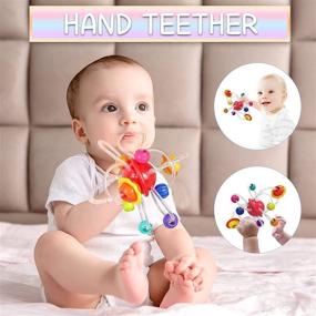 img 3 attached to Multi Sensory Learning Teething Toy for Babies 6-12-18 Months - Textured Planet Hand Catching Ball Hand Teether Baby Rattle Toy - Ideal Grasp and Chew Toy - Perfect Gift for Baby Girls and Boys