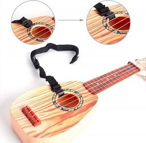 img 1 attached to 17 Inch Kids Guitar Ukulele: 4 Strings Ukeleles For Toddlers & Babies - Educational Learning Toy By Satisfounder