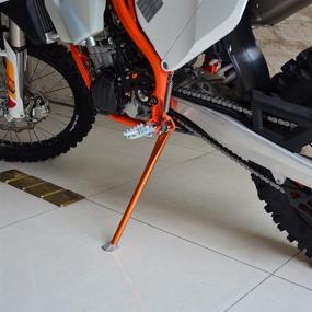 img 2 attached to 🟧 Premium NICECNC Orange Shortened Side Stand Kickstand for KTM & Husqvarna 125-500 Series - Enhanced Stability & Easy Compatibility 2008-2022